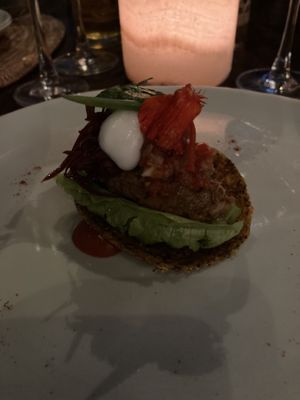 Flaxseed cracker with jackfruit served with avocado and tomato   at Sakti Dining Room in Mambal