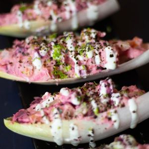 Pink Salad: fresh Russian salad cubes, with beet flavor and that punch of pickles and sweet and sour. Topped with tangy lime mayo and crushed nori seaweed, all wrapped in cubes of endive leaves at Doxa in Madrid