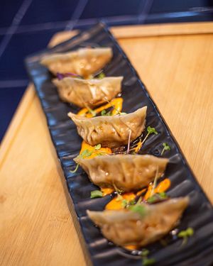 Iron Dumplings, with secret filling and sauces. Crunchy and toasted at the base, soft and creamy inside, smoky and sweet and sour at Doxa in Madrid