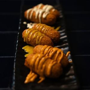 Falafels with pumpkin-chipotle sauce, agave-mustard, and pickle mayonnaise at Doxa in Madrid