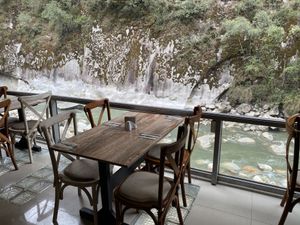 Tables overlooking the river  at KAYMANKA - Centenario de Machu Picchu in Aguas Calientes