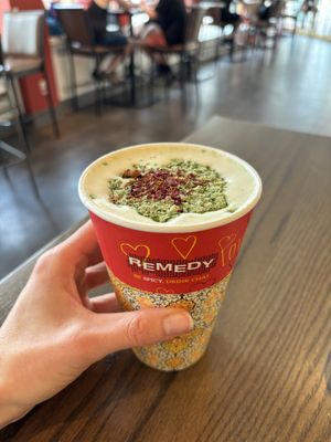 Kashmiri oat milk latte with pistachio & rose petals (caffeine free)  at Remedy Cafe - Jasper Ave in Edmonton