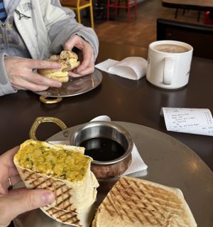 Chana masala wrap, oat milk hot chocolate   at Remedy Cafe - Jasper Ave in Edmonton