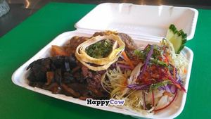 Take out box.  Braised shiitake mushrooms, yam potato curry, quinoa and mixed grains, cabbage salad.  Ready in minutes.  Healthy fast food at Wild Scallion in Penticton