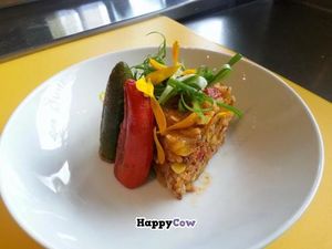 Vegan jambalaya bowl with vegan chipotle cheeze stuffed jalapeno peppers , topped wild flowers at Wild Scallion in Penticton