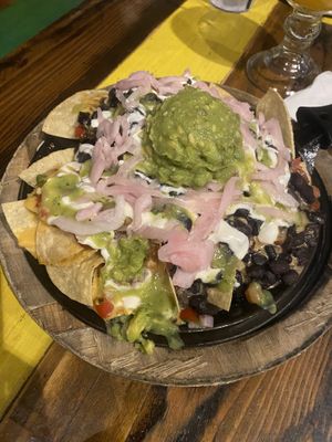 Vegan Loaded Nachos with added pickled onions  at Nacho Daddy - Downtown in Las Vegas