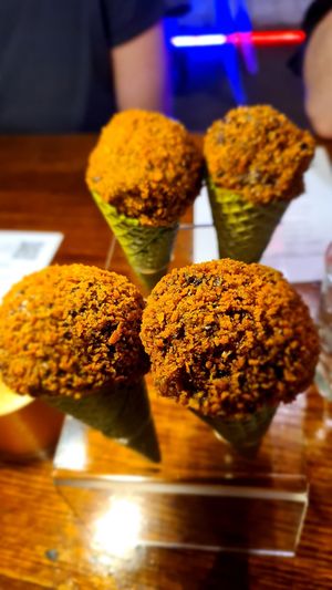 Asian mushroom rice cream in a matcha green cone at Shu in Collingwood