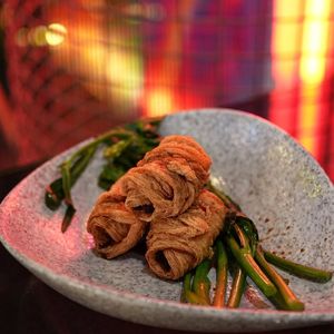 Hand rolled and crispy fried tofu skin, wrapped around spicy potato and okra mash at Shu in Collingwood
