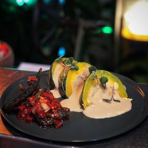 Japanese baby pumpkin with miso tahini cream, homemade pickle sweet chilli and mini gherkins at Shu in Collingwood