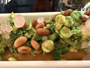 Salted mustard green with almond watercress pesto, ginger pearls and toasted pine nuts on Chinese donut  at Shu in Collingwood