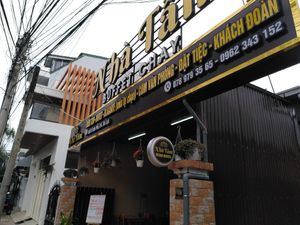 Front with the vegan buffet sign at Nhà Tấm in Da Lat