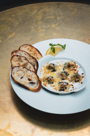 Escargot: Wood ear mushrooms, shallots, parsley, butter, garlic, gruyere, toasted baguette

 at Le Basque in New York City