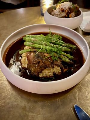 Blue Oyster Mushroom Steak 
Smoked lemon orzo, grilled asparagus, red wine gastrique, spring onions  at Le Basque in New York City
