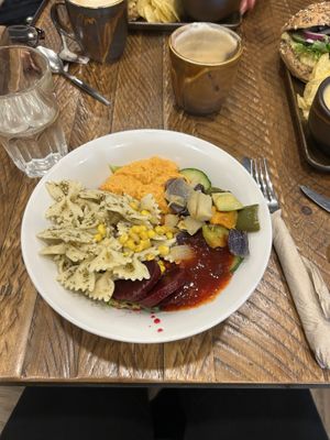 pesto pasta salad bowl with coconut milk latte  at The Deli Next Door in Elgin