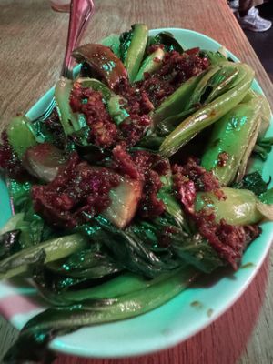 Garlicky greens with vegan duck  at Spicy Moon - Chelsea in New York City