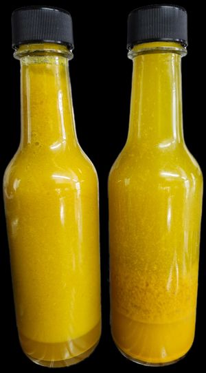 Organic Turmeric Vinaigrette, 2 options available, one made with Agave Nectar,  and one made with Paradise Nectar Apiaries honey.  at Island Organic Cuisine in Hilo