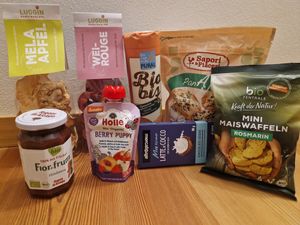 Dried apples, cookies, crackers, jam, pocket smoothie, chocolate, corn waffles. at Golmarket Unterthurner in Naturno