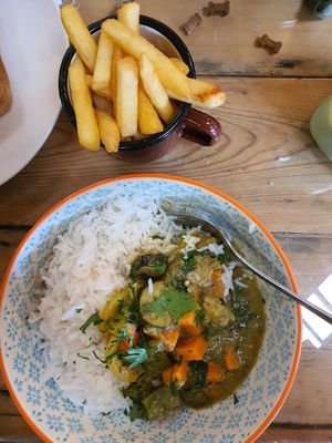 Green Thai curry special vegan with rice and chips at The SugarPlum Tearoom in Ruthin