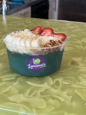 Mermaid Magic- coconut milk, spirulina, banana, mango pineapple, agave. Topped with granola, coconut, strawberries, bananas.  And you can substitute the honey drizzle for agave.  at Larissa's Apron Green  in Pullman