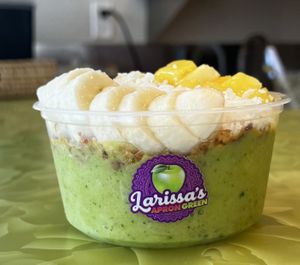 Tropical Twist Bowl- coconut milk, mango, pineapple, kale, agave. Toppings, granola, pineapple, banana passionfruit agave.  at Larissa's Apron Green  in Pullman