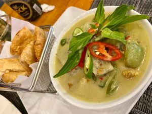 Green curry with tofu and baked roti on the side at The Planters in Ao Nang