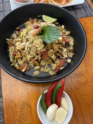 Tea leaf salad (not certain  what to do with the raw garlic and peppers served on the side)   at The Planters in Ao Nang