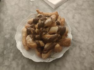Franfellicche: a vegan dessert made of fried pizza dough with sugar, cinnamon and vegan nutella. at Antica Pizzeria Chiaia in Naples