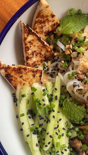 Chilled peanut coconut noodles with pan fried tofu, mushrooms, lemony cucumber, peanut crumble  at Bunch in Hiriketiya