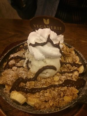 Warm cookie covered in fruit, ice cream, whipped cream, and drizzled with chocolate. All vegan. at Veganerie - Mercury Ville in Bangkok