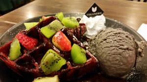 Red Velvet Waffles with Black Sesame Ice Cream, Chocolate Sauce, and Cream (100% Vegan) at Veganerie - Mercury Ville in Bangkok