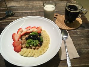 Mixed fruit with vanilla and granola (and a black americano) - great breakfast  at Veganerie - Mercury Ville in Bangkok