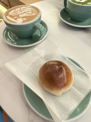 Oat latte and “pork” bun  at Paper Sons Cafe in New York City