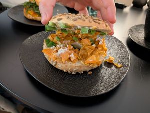 Bagel Breaking bad with cashew cream, sweet potato crunch and spring onions. at GegenVind Café in Hamburg