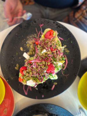 Toasted sourdough with avocado, vegan feta, raspberries and pumpkin seeds  at Coffee Woolston in Southampton