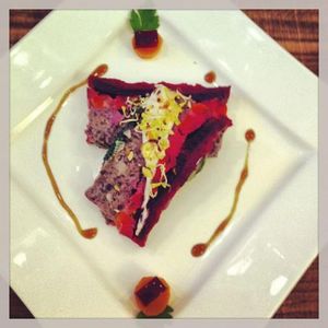 Veggie terrine - made with carrots , basil, beetrout, blak brans and horse radish sauce. at LoVegan in Bucharest