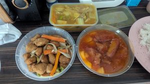 Salt and pepper vegan chicken (bottom left), mixed vegetable curry (top) and roast pork in Thai sauce (bottom right) at The Pagoda in Caerphilly