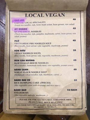 One page of the menu (highlighted in purple are the dishes pictured)  at Quan Chay Dam in Hoi An