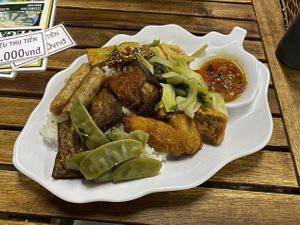 Rice with toppings at Quan Chay Dam in Hoi An