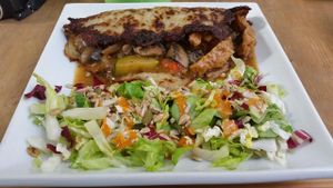 Placek po wegiersku or seitan and veggies in potato pancake at W Gruncie Rzeczy in Warsaw