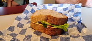 Sandwich with vegan cream cheese, vegan cheese, radish, tomato, and lettuce. The bread is delicious. at Namo Bakery in Warsaw