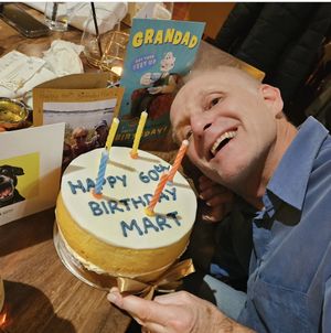 Happy hubby with vegan cake!  at Around the World Bakes in Preston