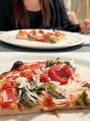 parmigiano vegano, salsiccia vegana, cime di rapa e pomodorini   at Languorino in Cesena