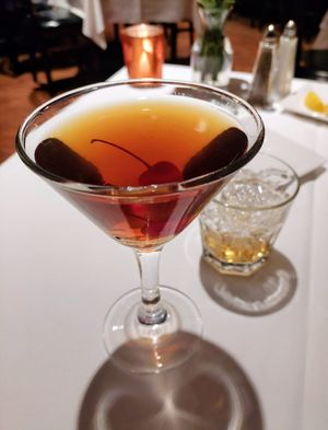 Rye Manhattan with shaker of (dirty) ice on the side, thank you! $2 off for Happy Hour. at General Warren in Malvern