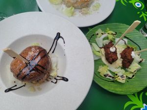 Mushrooms stuffed with orange tartar and vegetable bocadito at MALQUERER in Sevilla
