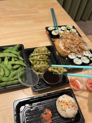 Pictured, salted edamame in pods, vegetarian assorted set 27 pieces, vegetable gyoza’s and from the specials spicy tofu onigiri rice balls.  at More Than Sushi in Poole