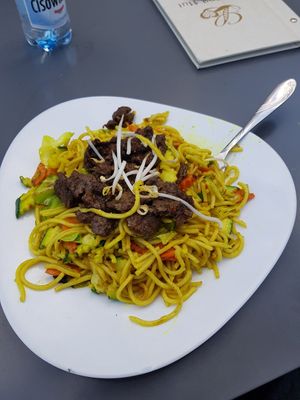 fried wheat pasta with beef substitute at Loving Hut - Warynskiego in Warsaw
