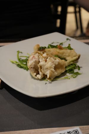 Stuffed zucchini flowers with almond ricotta, salami, and cheese at Arrecrià Bistrot in Naples
