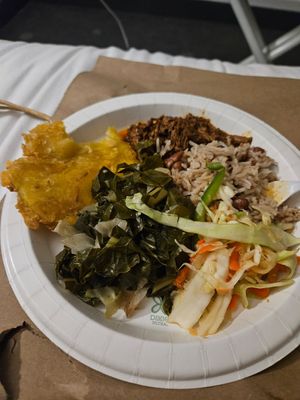 A plate with several dishes that I sampled: pinto rice, spicy slaw, greens, tostones, and barbacoa ste'k. Portions we received were much larger! at PurelyPlant in Atlanta