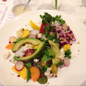 Lunch special salad. Brown rice covered in delicious veggies and vegan cheese with soy dressing on the side. at G and V in Tokyo