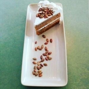 Vegan Chai Carrot Cake with maple glazed pumpkin seeds and buttercream frosting at The Coup in Calgary